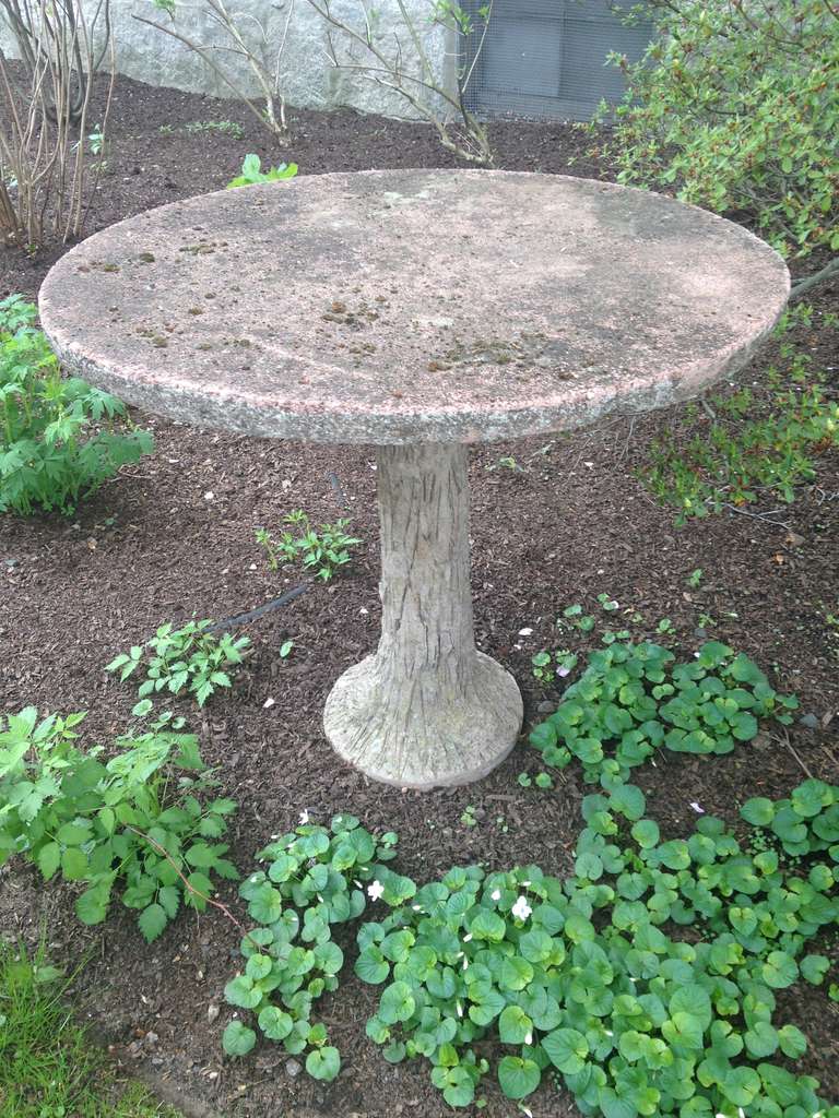 This beautiful French faux bois table is perfect in the garden or on your patio as a drinks table or small dining table for two.  The top has bits of moss and the entire table is in lovely condition.  The top comes off for easy shipping.  We also