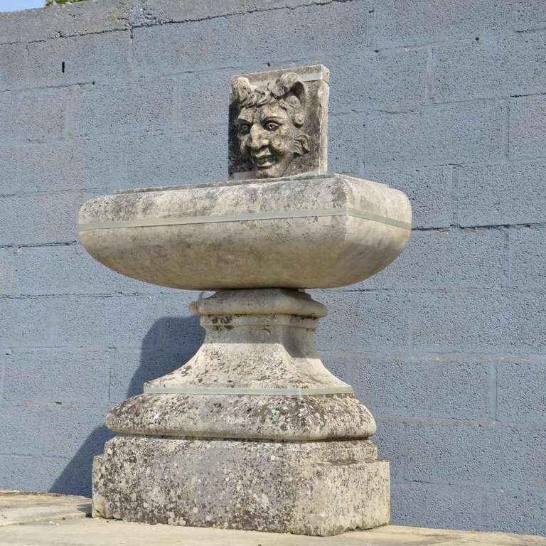 This statuesque French wall fountain is the most beautiful one we have ever owned! In two parts and carved from the finest French limestone, its elegant form and superb weathered patina make it a highly desirable piece. The bowl is sufficiently deep