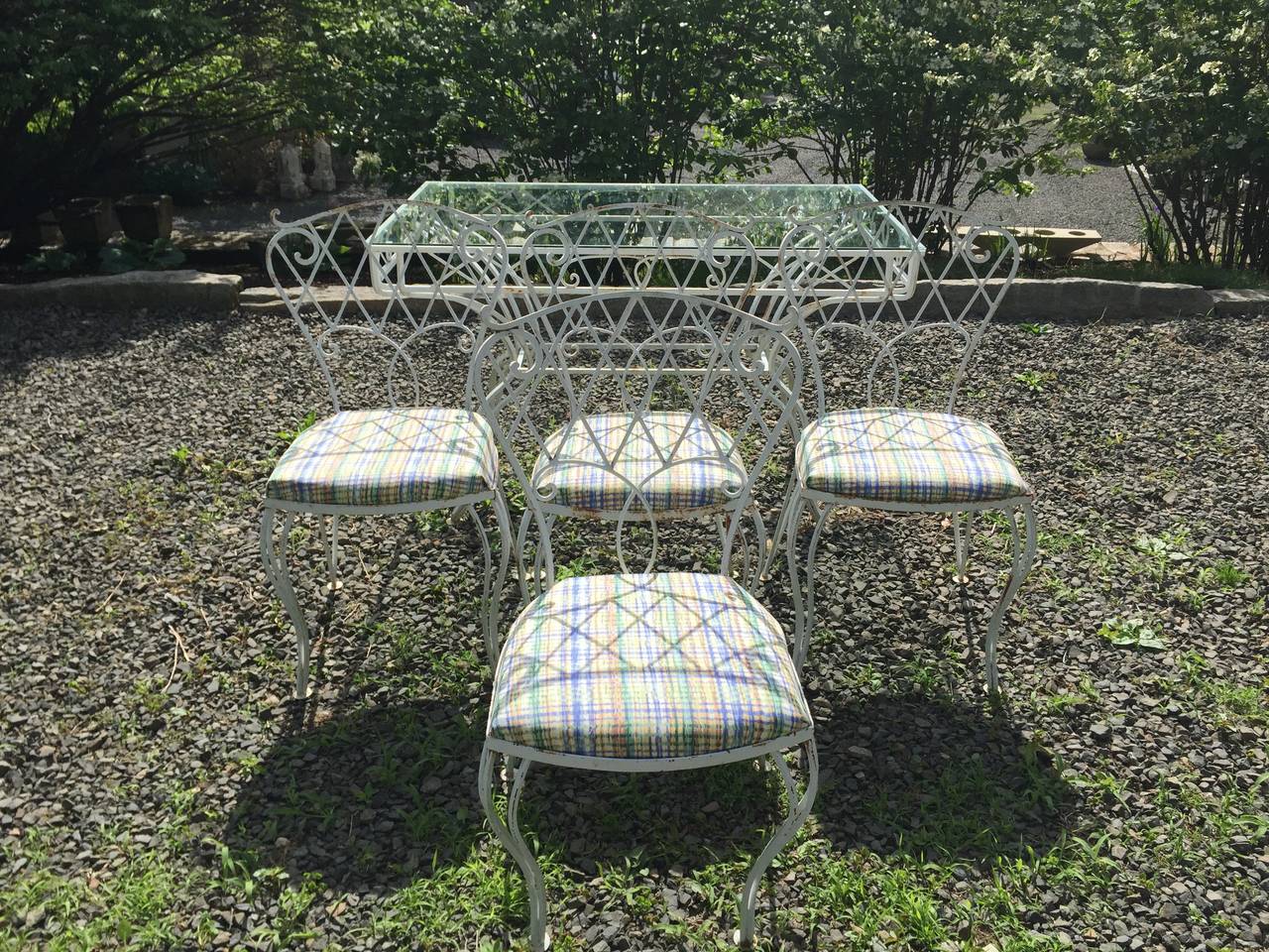We love this vintage wrought iron set for its gracious lines, super-comfortable chairs and gently-worn vintage look. In excellent structural condition, it was sandblasted and repainted a few years ago, but does have rust spots here and there which