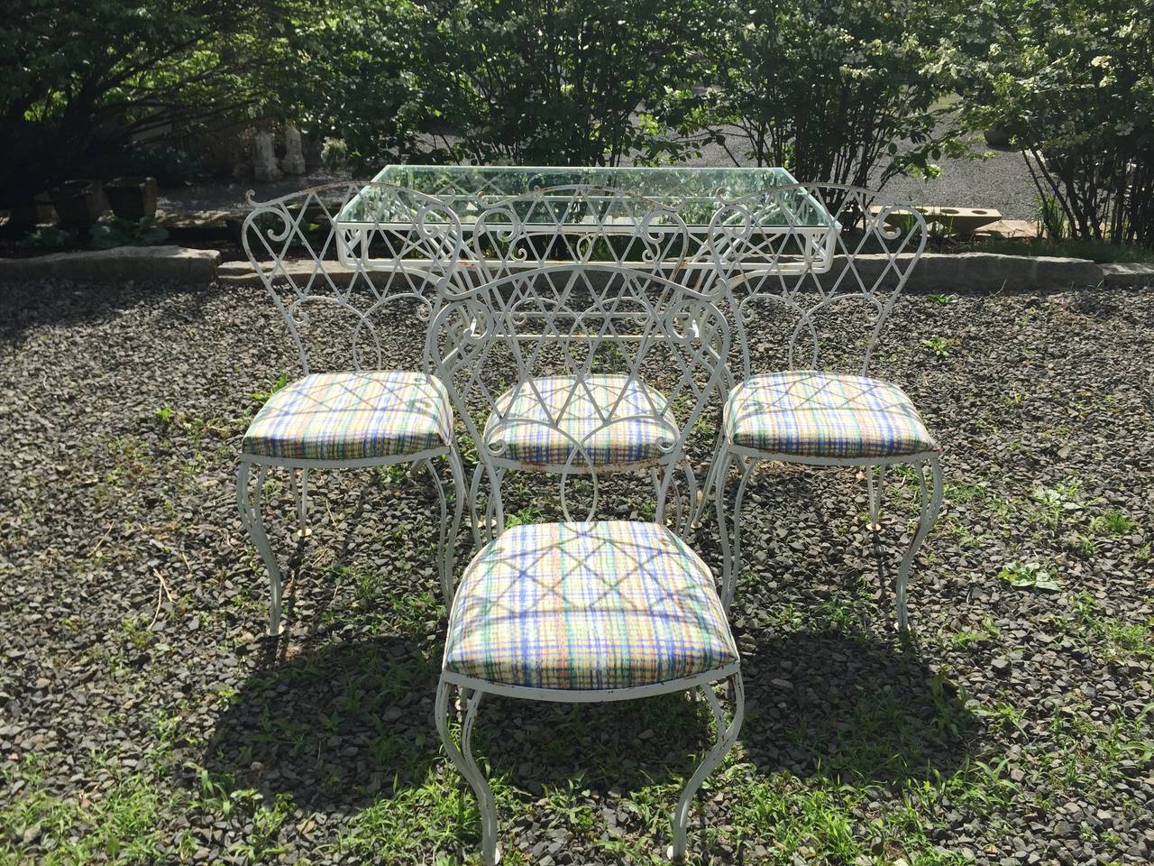 We love this vintage wrought iron set for its gracious lines, super-comfortable chairs and gently-worn vintage look. In excellent structural condition, it was sandblasted and repainted a few years ago, but does have rust spots here and there which
