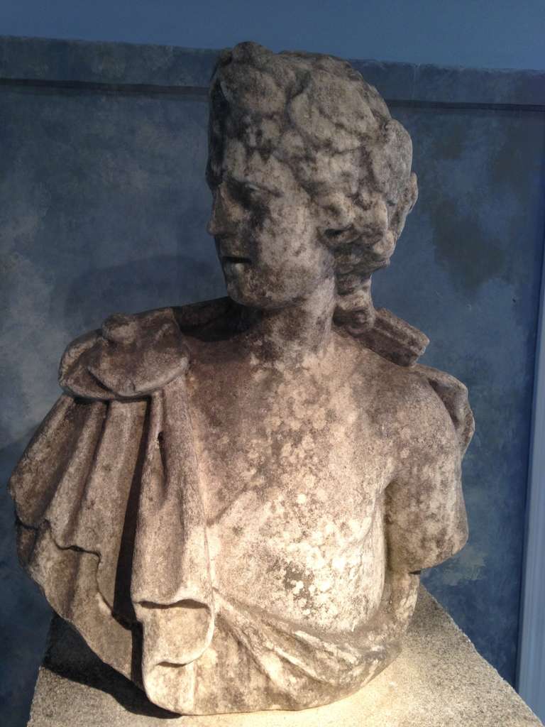 Hand-carved from marble after the Apollo Belvedere and dating to the late 18th century, this exquisite life-sized bust is in very good antique condition, with only a very old and weathered repair to the nose. It will make a perfect addition to your