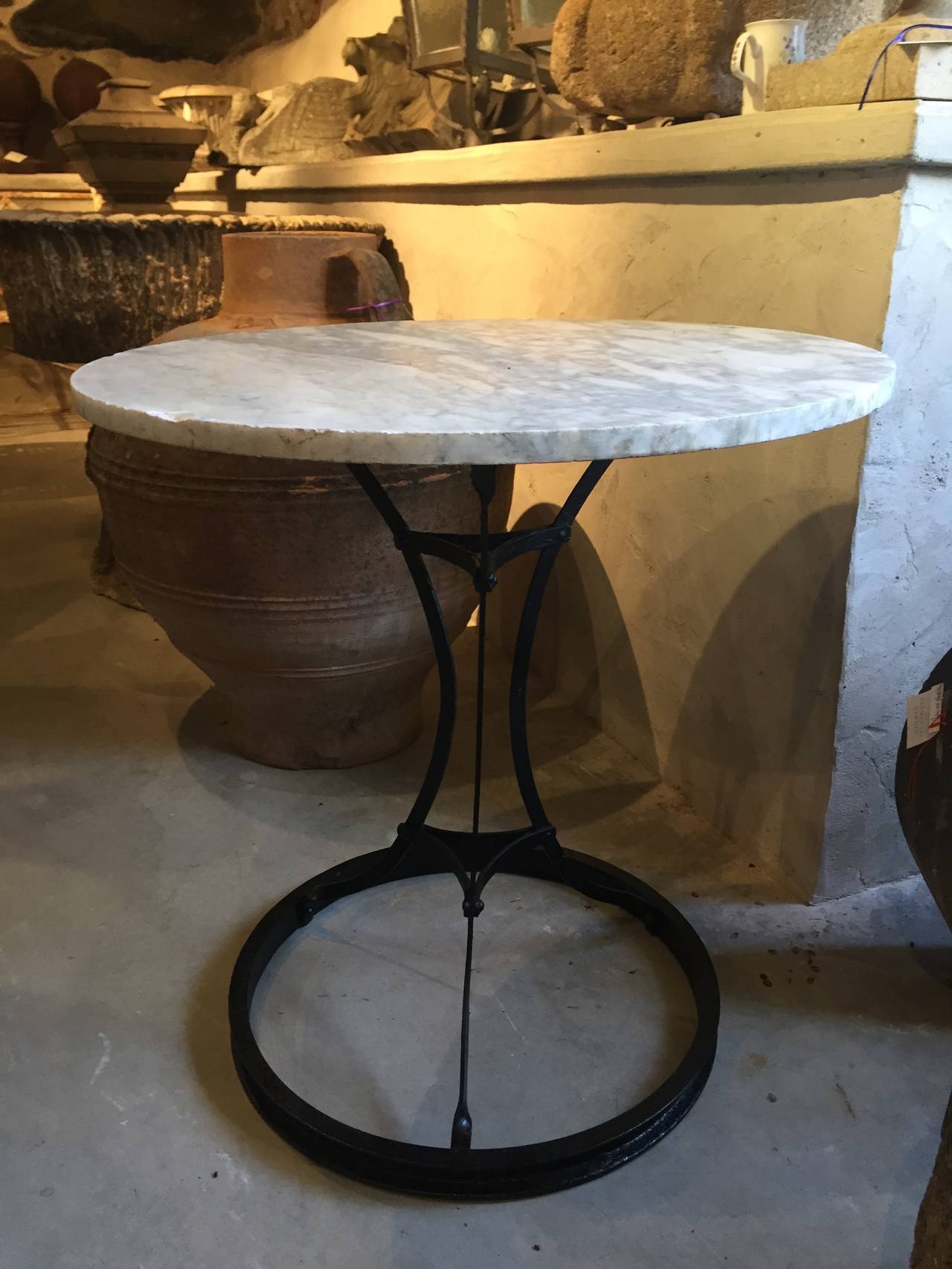 This charming French steel bistro table dates to the 1920s-1930s, but we have repainted it in satin black and added a 1