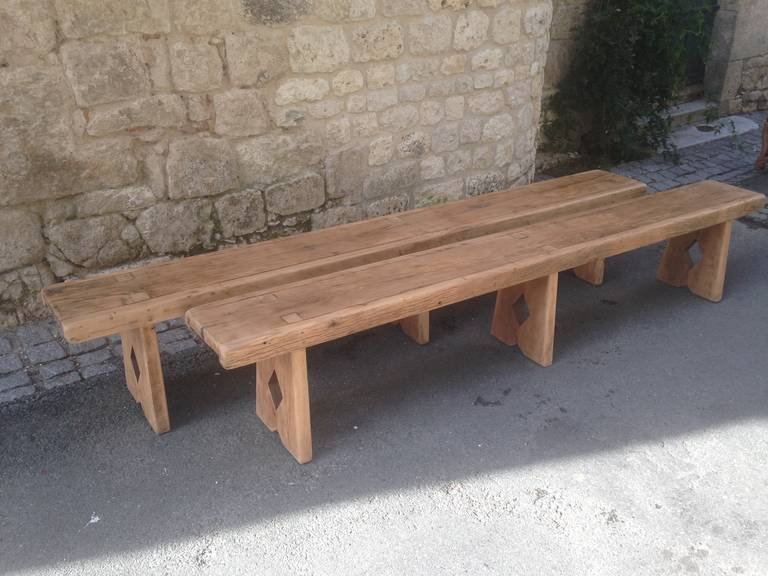We love these benches for their warm, pale color, lovely grain and their unusual commodious depth for French benches.  We have stripped and waxed them to bring out the beauty of the wood and they are extremely sturdy.  Each seats between 5 and 6
