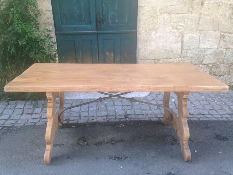 We love this heavy oak table for its utilitarian size, warm light oak color and decorative Spanish-style base. Inspired by the style of 18th century Spanish refectory tables, it has been sanded, coated with a water-proof polymer and then waxed to a