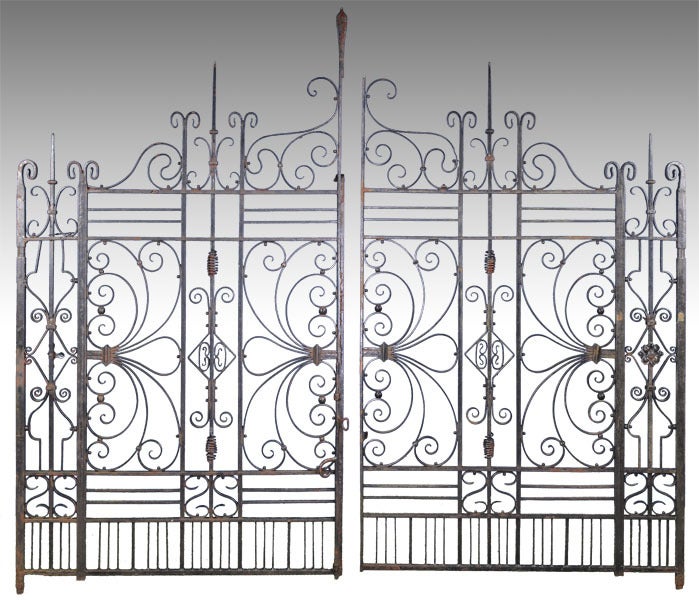 This magnificent and rare pair of wrought iron entrance gates is in very fine condition and would make a stunning portal to your home or garden.  The gates are signed 