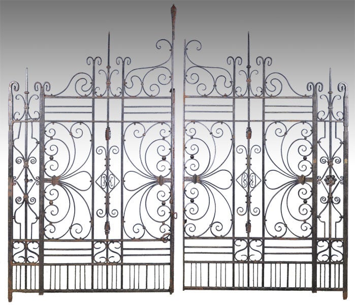 This magnificent and rare pair of wrought iron entrance gates is in very fine condition and would make a stunning portal to your home or garden.  The gates are signed 