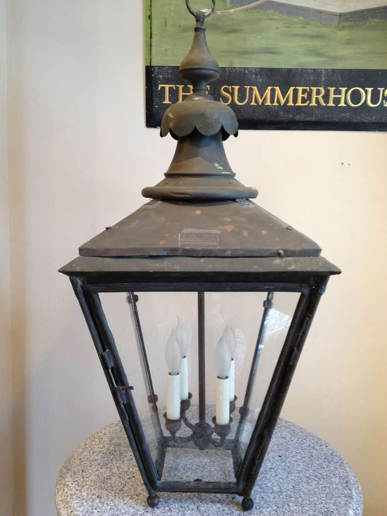 Signed by the maker (W. Parkinson & Co. of Birmingham & London), and dating to around 1910, this elegant copper gas lantern with scalloped finial has been fully restored and electrified. We have added a custom brass lighting cluster (total 300 W)