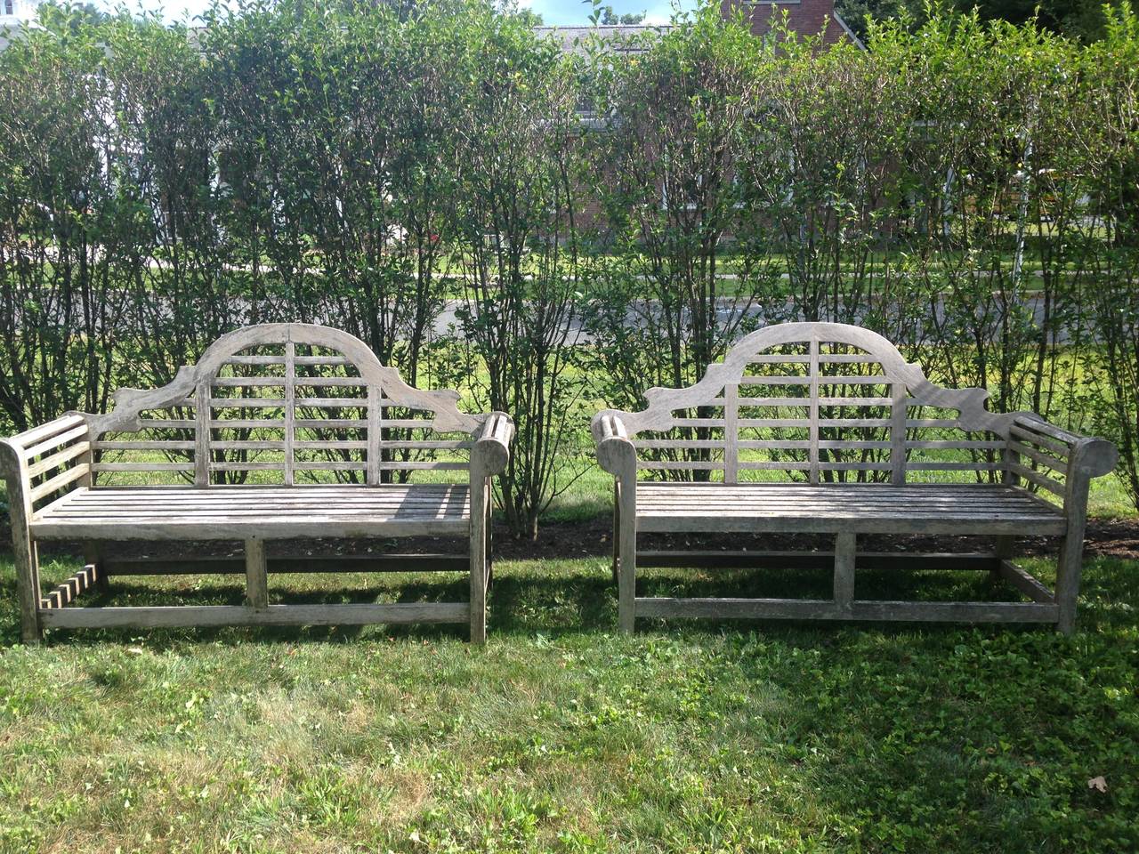 This nicely-silvered pair of Lutyens benches is extremely sturdy and will give you decades of pleasure in your garden. Beautiful in a terrace seating area or on either side of an outdoor dining table, they are classically elegant against a backdrop