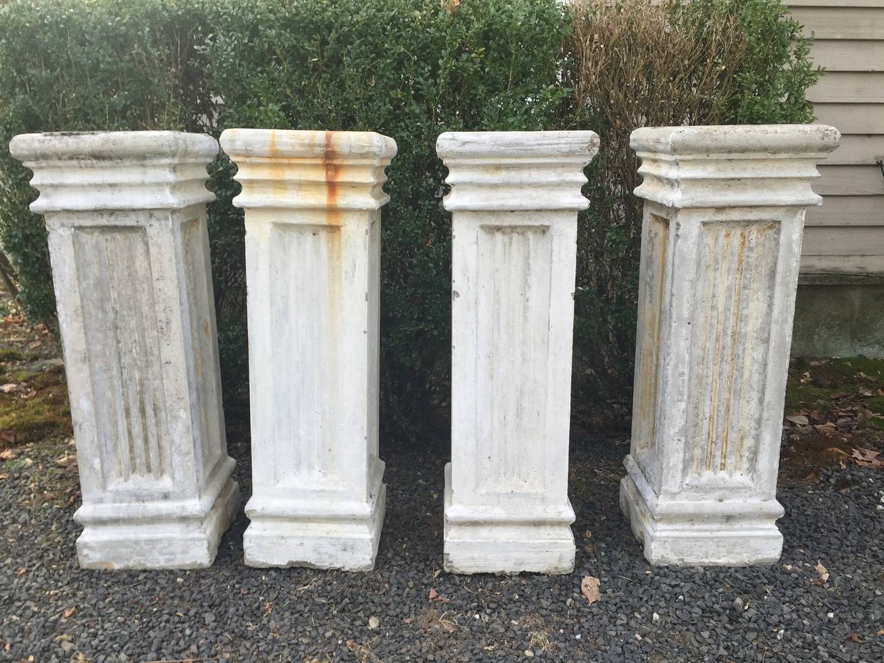 We love these pedestals for their weathered limestone wash and chippy paint, as well as their classic design and wonderful detailing. Perfect in the garden, on the terrace, or flanking a doorway to display pots with exuberant plantings or small