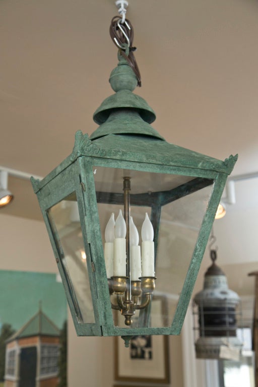This beauty is a smaller, mid-20th C version of the classic English street lantern copper we typically offer and its original spotty surface has been boldly enhanced by our artisan metalsmith to a full-fledged verdigris.  Fitted with a 4-bulb