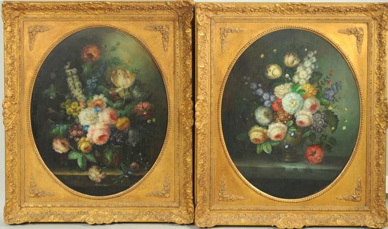 Pair of Dutch old master style floral still life paintings, oval presentation in very fine carved and gilded frames. Oil on canvas, each signed in lower border 