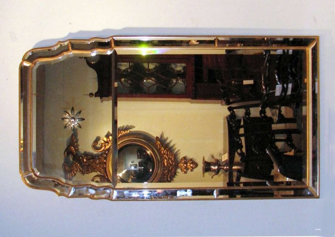 Mid-century Venetian Queen Anne style mirror, with ogival shaped beveled upper glass with compass star etched detail, over a rectangular vertical beveled glass plate with perimeter beveled sections. 20th century.