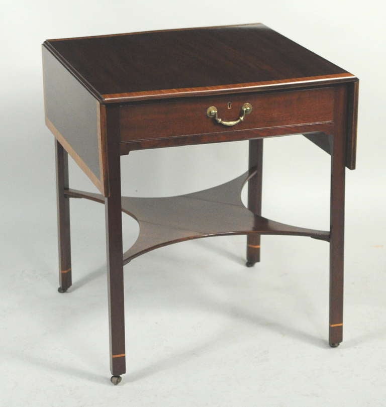 Fine George III satinwood inlaid mahogany drop leaf pembroke or sofa table, with finely figured top with satinwood crossbanding, above a frame with one working drawer with rococo brass, set on square chamfered legs with narrow satinwood cuffs.