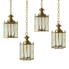 A set of 4 brass heaxagonal lanterns with etched glass panels