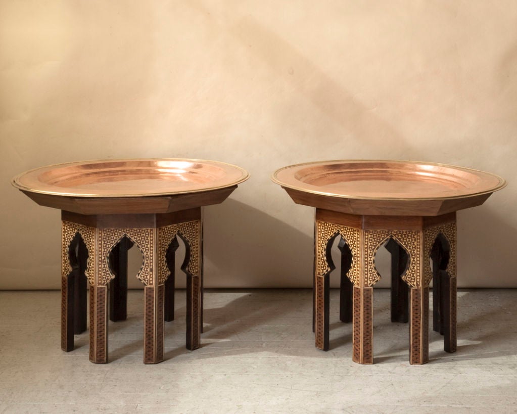 Pair of octagonal Orientaliste tables with round brass tray tops