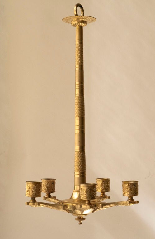 A small Charles X-style gilt bronze five-arm chandelier, French 19th century, not wired- as is.

Measures: Diameter 8 1/2
