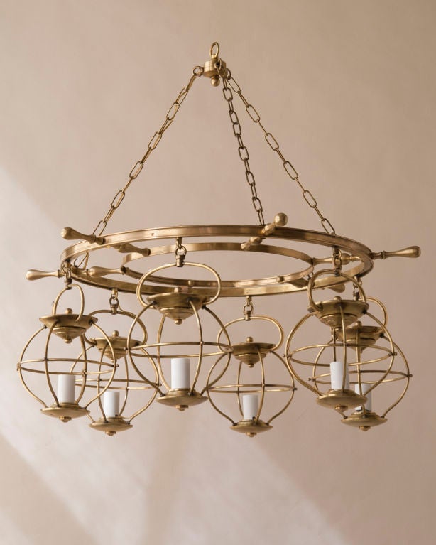 A brass “ship’s wheel” 6 light yacht  chandelier, French, 20th century, wired for electricity<br />
Diameter-31