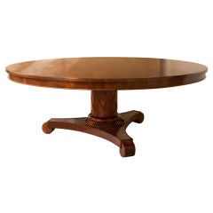 A Regency style large mahogany table, round top pedestal base A Regency style large mahogany table, round top pedestal base