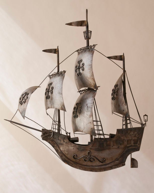 An unusual tole model of an antique sailing ship wired as a chandelier three lights, Continental

Measures: Width 30