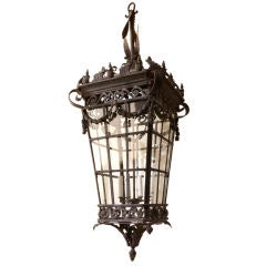 A large tapering square iron and tole lantern