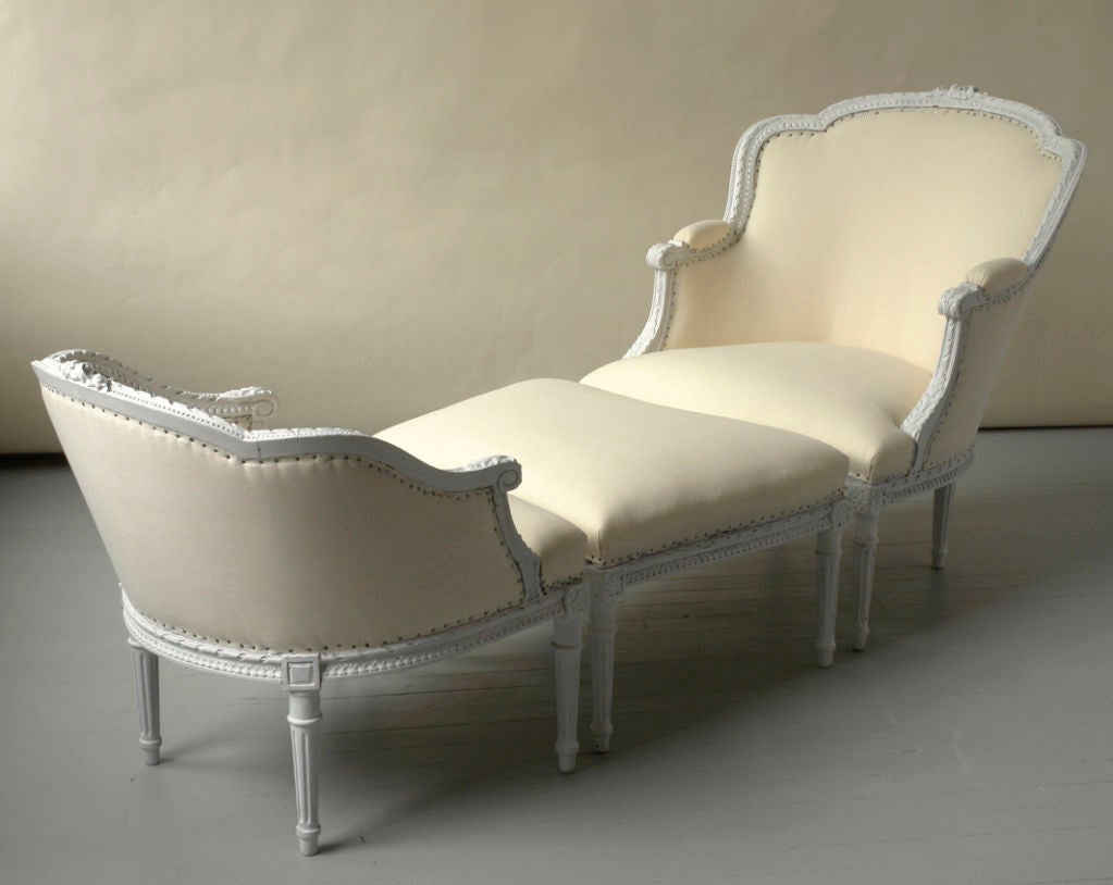 A fine Louis XVI style duchesse brisee, carved and white painted