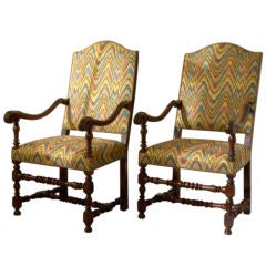 Louis XIII natural wood fauteuils with an arched back
