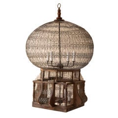 An Orientaliste style large wire and wood birdcage