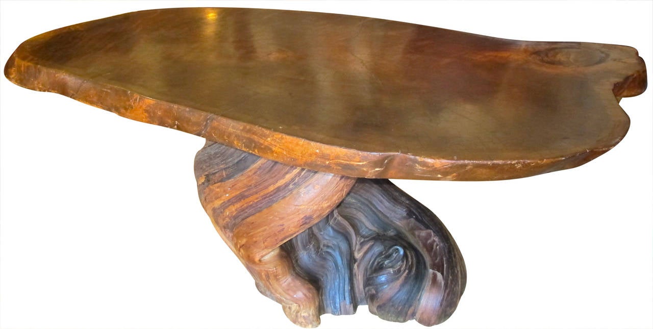 Gorgeous table with stunning sculptural trunk base and slab of walnut top. The patina is gorgeous.
