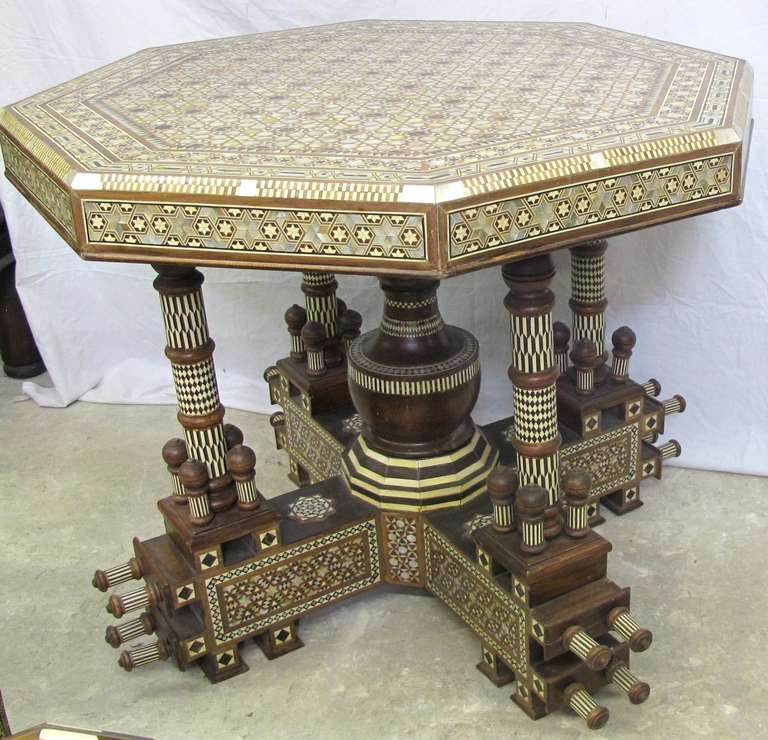 Outrageous octagonal Syrian table with Mother of Pearl and bone inlay designs throughout in various geometric patterns.