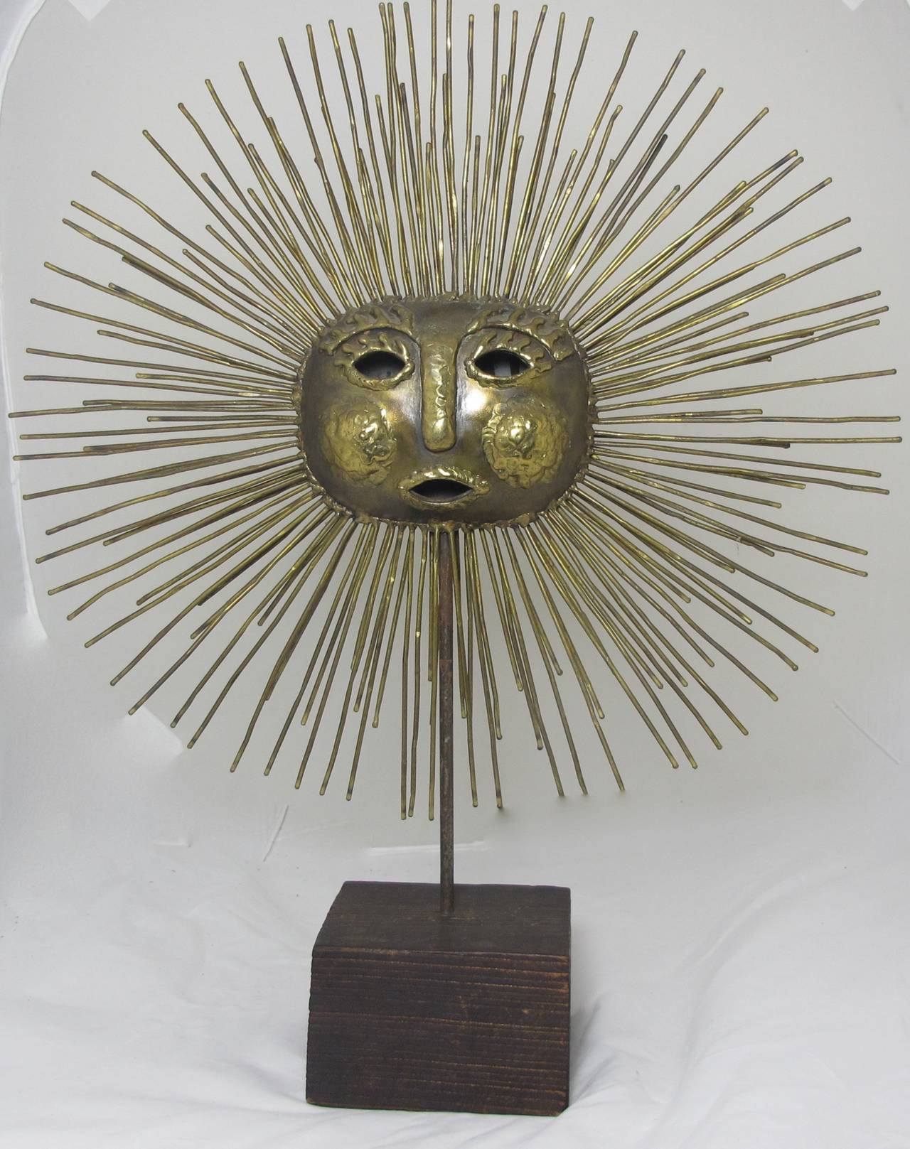 Brass sun sculpture on stand by Sergio Bustamante. Brass and copper.