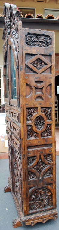 Excellent 18th Century Mexican Chippendale armoire. Heavily carved throughout. Original antique mirror. This is an extremely rare Spanish Colonial piece. The interior of the armoire has been lined with antique Fortuny fabric.