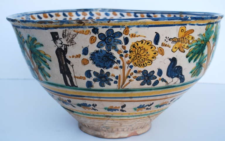 Very large beautiful bowl from Sevilla, circa 1870. Decorated with various figures, animals and plant life. With the name 