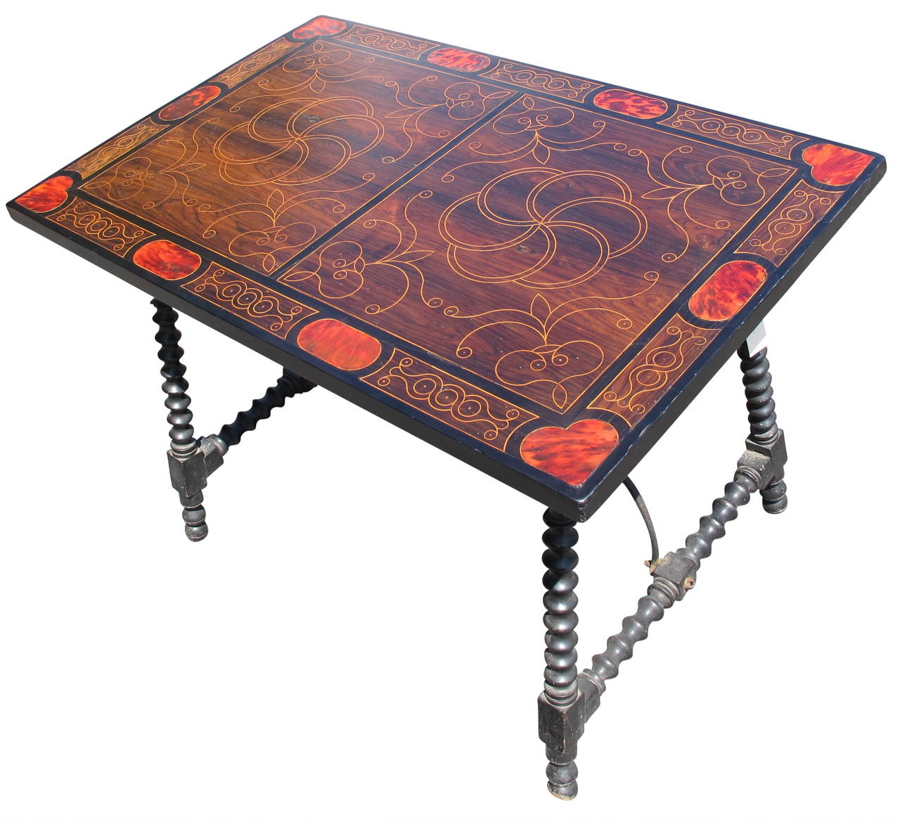 Beautiful inlay work throughout this rare Spanish table. Ebonized turned legs and wrought iron stretcher.