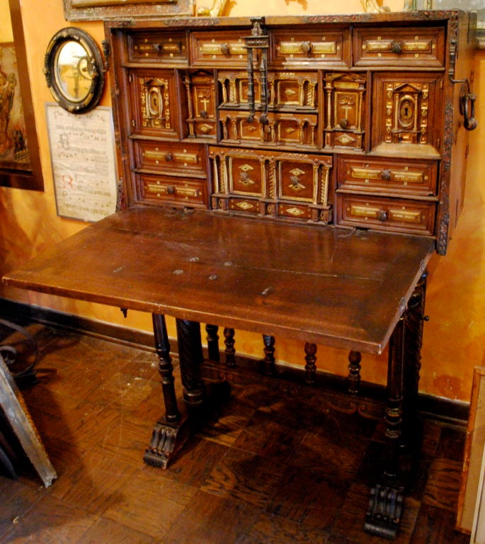 An excellent 17th Century Spanish Vargueno on stand. The stand is likely later. Inlayed bone and gilt elements. Multiple drawers and outstanding iron work.<br />
<br />
<br />
<br />
<br />
<br />
<br />
<br />
<br />
Haskell
