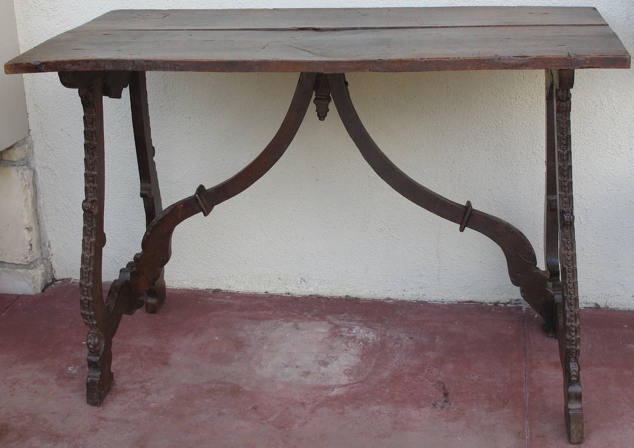 Beautiful early Italian table with lyre legs.