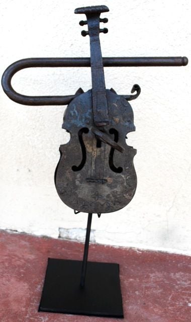 Beautiful 19th Century iron violin on stand.<br />
<br />
<br />
<br />
Haskell Antiques-Specializes in rare 16th, 17th, 18th Century Italian, Spanish, French, Syrian, Moroccan, French, Spanish Colonial, Anglo Indian, Portuguese, Native American