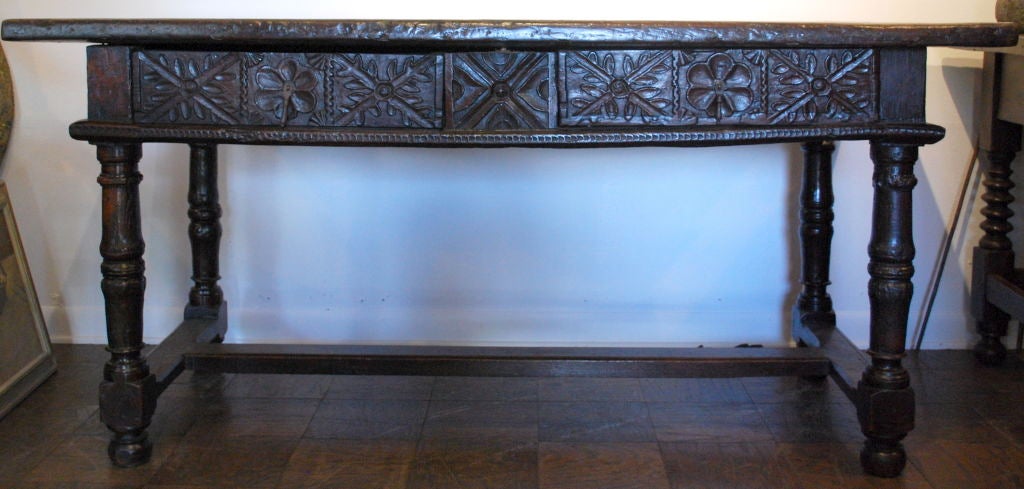 Beautiful Spanish carved console table. Two beautifully carved drawers. Carved on all sides, can float in a room as well. Single slab top.

Haskell Antiques-Specializes in rare 16th, 17th, 18th Century Italian, Spanish, French, Syrian, Moroccan,