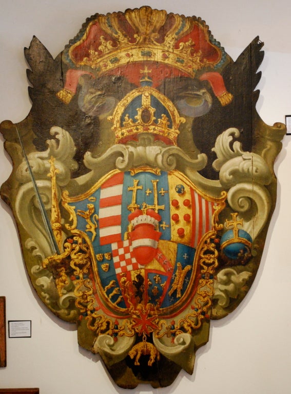 Very rare 18th Century painted Coat of Arms . It was a gift commemorating the marriage of Hapsburg and Lorraine families, the shield is a hardwood with a wrought iron loop on back

In the Holy Roman Empire's heraldry, the double-headed eagle