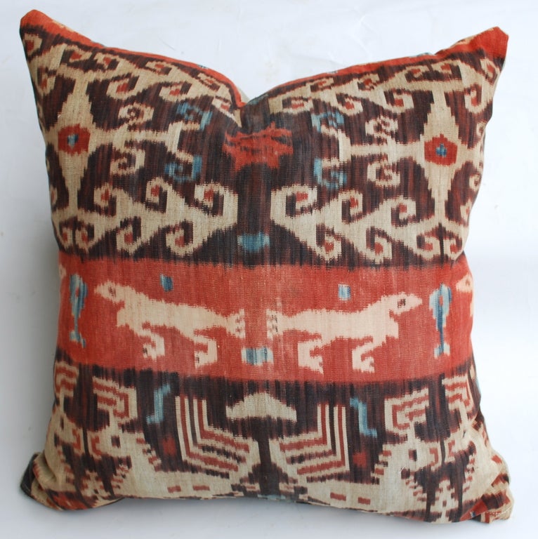 These beautiful Ikat pillows are made using an antique Ikat textile on the front with a linen backing. One pair has a deer central motif. The other with what appears to be a bird. They are filled with a high end feather insert. Two pairs or can be