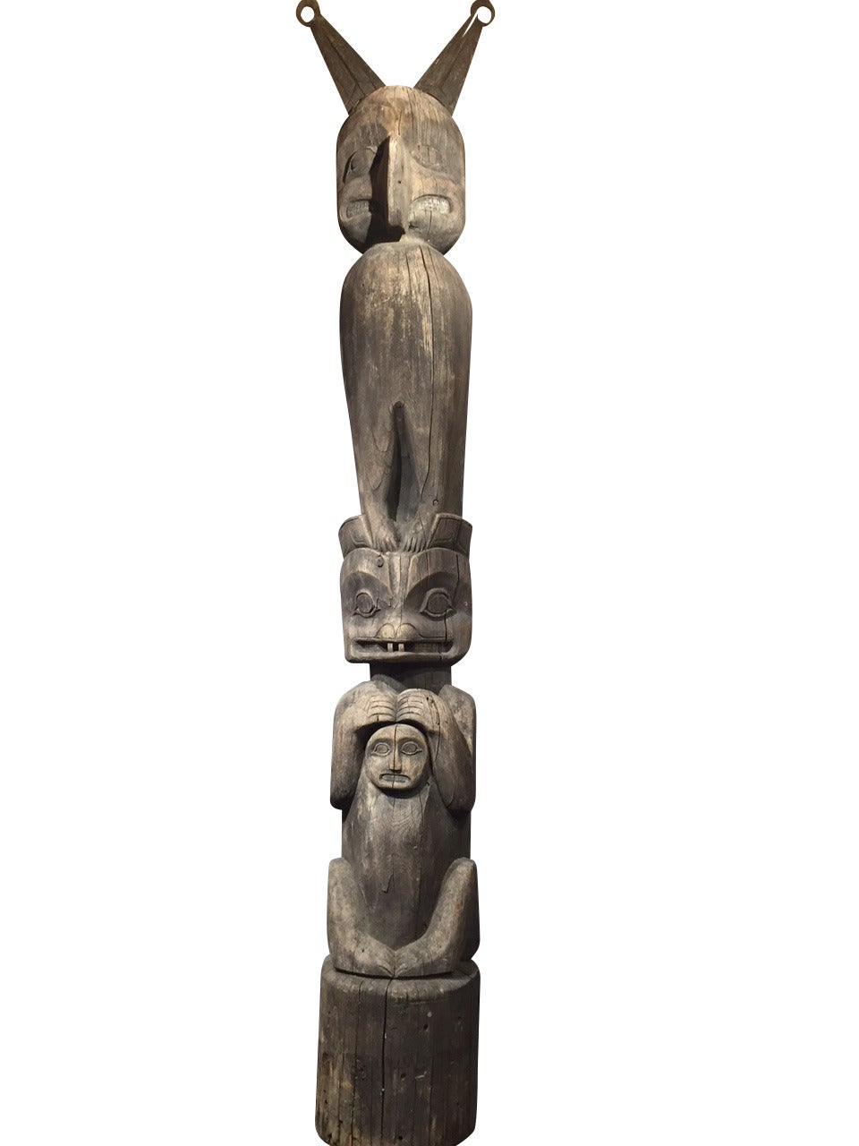 19th Century Kwakiutl Clan Totem Pole from Alert Bay, Alaska circa 1870. This famous Totem Pole is pictured in many historic photographs and postcards in front of the Nugget Shop in Juneau, Alaska with a fresh paint job circa 1915. Weathering has