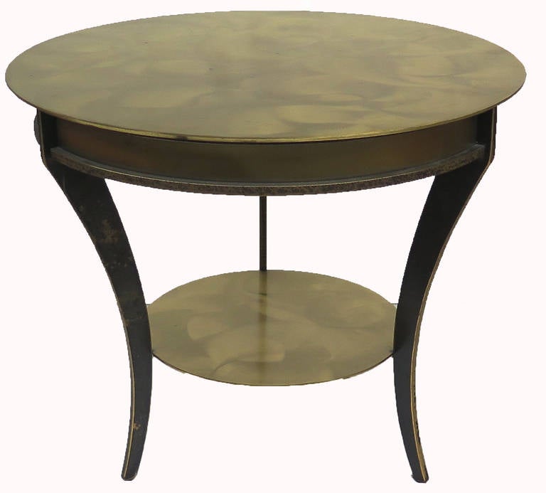 Attractive heavy pair of modernist two-tiered end tables. Very heavy with a great looking patina.