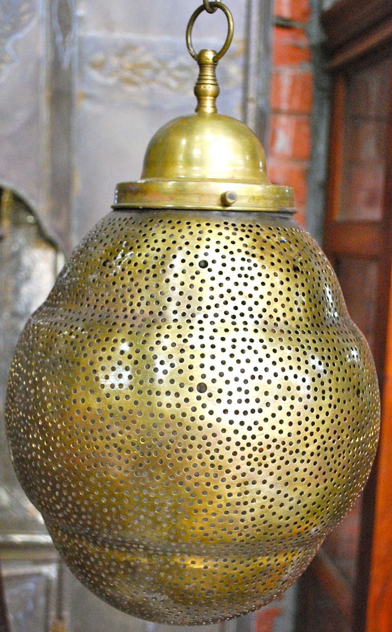 Beautiful Moroccan brass fixture with small holes to create beautiful light.