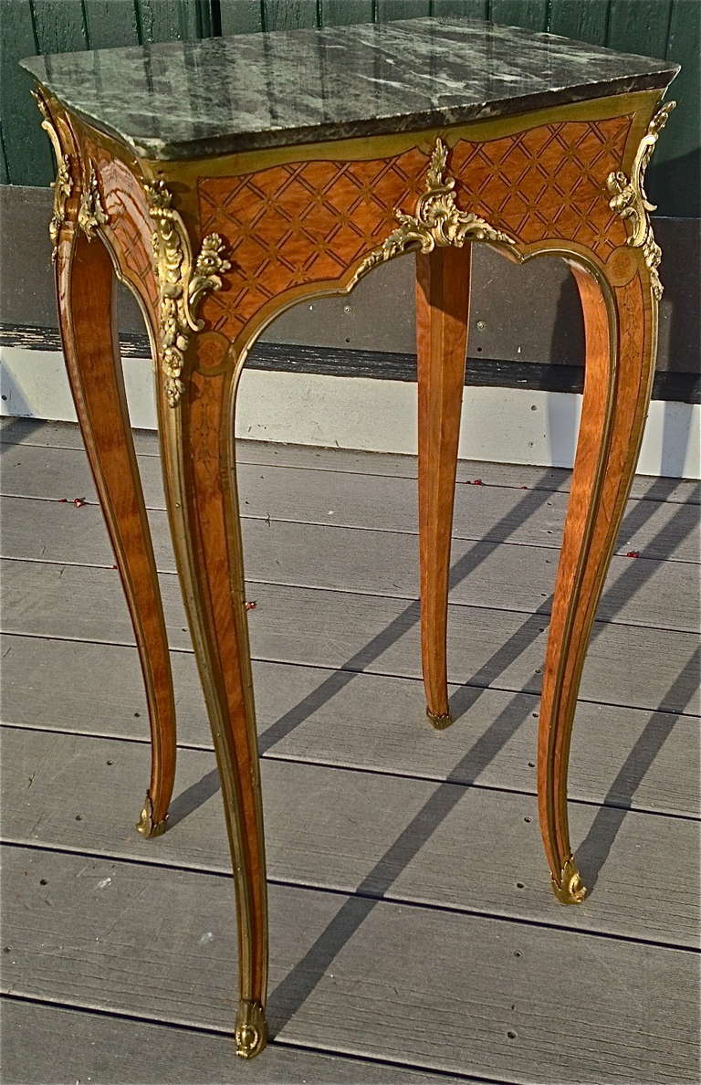 Louis XV Inlaid and Ormolu Mounted Satinwood Table

--original marble top
--original ormolu