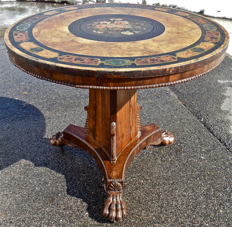 Rare Period Regency Center Table with Original Painted Slate Top which Emulates Neoclassical Petra Dura or Inlaid Marble

--Pyramidal Column with Tripartite Base, Lion Paw Feet and Irish Shell Carved Above Each Foot
--Rare and Intact Neoclassical