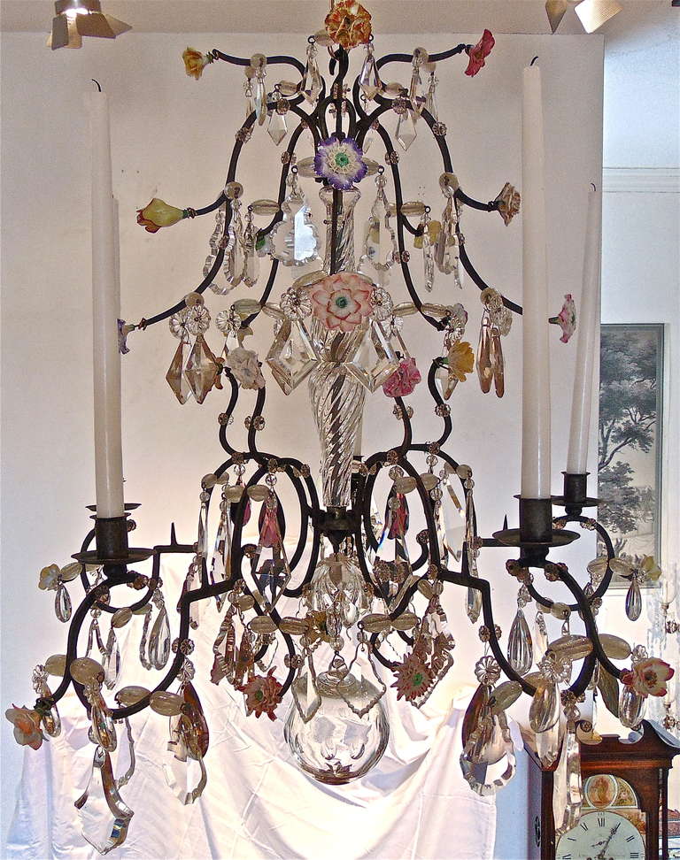 18th Century French Provincial Iron and Crystal Chandelier

--Naturalistically Formed Vincennes Style Porcelain Flowers
--Hand Wrought Iron Body
--Early Crystal Pedagogues
--Late Louis XV to Early Louis XVI
--Can be Wired for