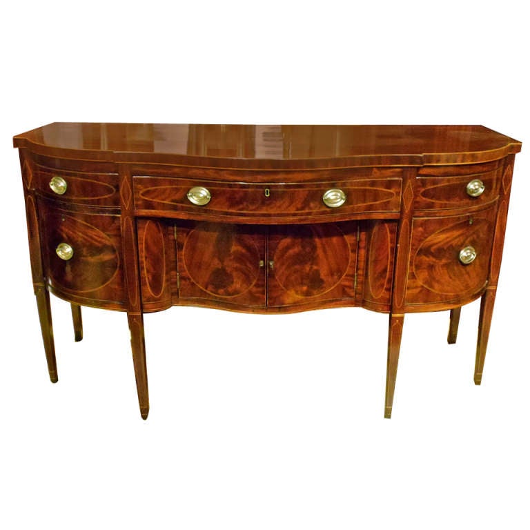 Exquisite New York Federal Period Sideboard

--Bookmatched Crotch Mahogany Veneers and Solid Mahogany
--String Inlay, Tapered Legs, Serpentine Front
--Early Clean Finish
--No Reduction in Height