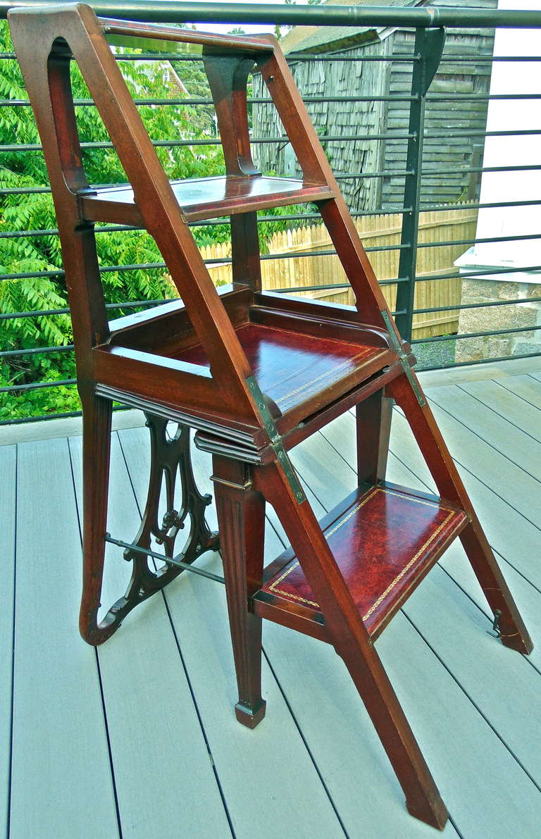 Metamorphic Georgian Style Chair which Becomes Library Steps

--Well Carved and Selected Cuban Mahogany
--Flips Over and Opens to Transform into Usable, Study Leather Covered Library Steps
--Carved Form Seat and Neoclassically Inspired Square