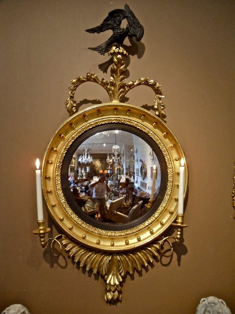 Rare PAIR of English Neoclassical Convex Mirrors.  Right and Left Eagle Pediments Atop Foliate with Double Arm Girandoles for Candles.  Styling Between Late George III and Early Regency 

To Remain Intact, A True Survivor
