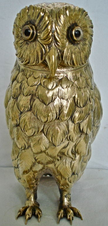 Silver Owl Form Humidor.  Realistically Modeled, Chased and with Glass Eyes.  Retains Most of Its Original Gold Wash.  Head Is Removable for Cigar Storage.  German Hanau Silver Marks of Late Nineteenth Century.