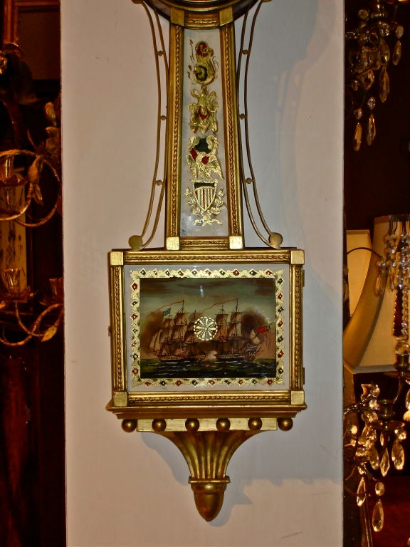 American Federal Banjo Presentation Clock Signed Aaron Willard, Boston.  Bottom Tablet Glass Original Eglomise Depiction of The Engagement Between USS Constitution and HMS Guerriere of the War of 1812.  Original Gilding and Works.  Original McIntyre